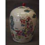 An early C20th Chinese famille verte jar and cover with enamel decoration of boys dancing in