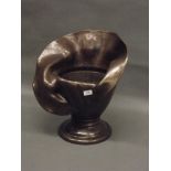 A bronze jardinière in the form of a lily, unsigned, 20" high