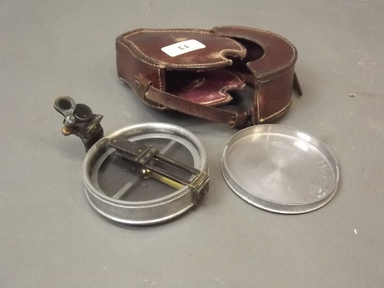 A Negretti & Zambra surveyor's prismatic sighting compass with original leather case, c1900, 4"