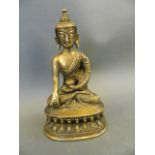 A Chinese bronze figure of Buddha seated in meditation, 7" high