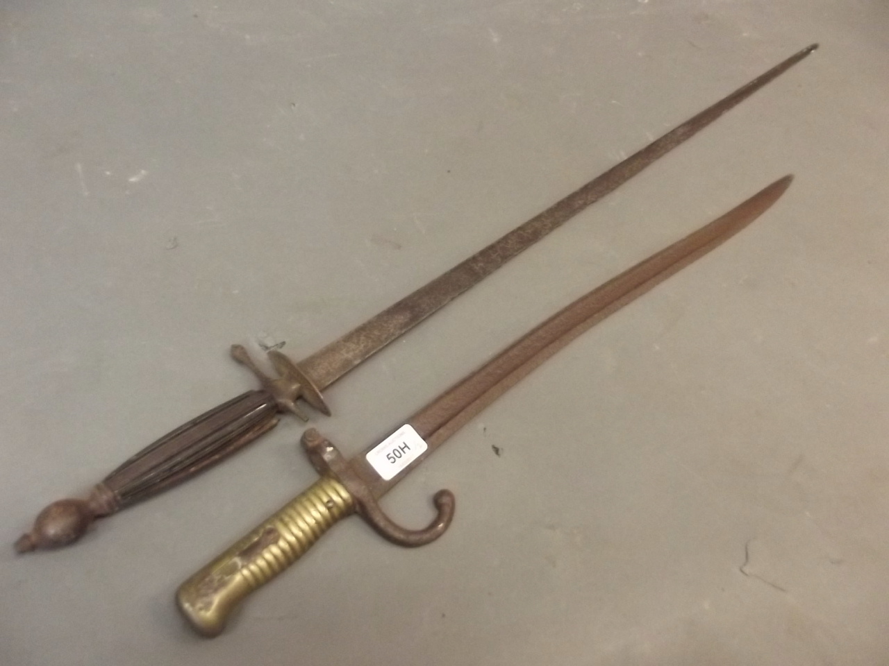 A late C18th/early C19th Cullum, King's Dragoon Guard's sword, and a C19th French bayonet (AF)