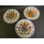 Three C19th porcelain plates with later painted coat of arms decoration, impressed Lozenge marks,