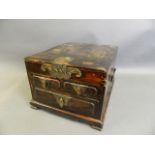 A Chinese hardwood vanity box with three drawers and folding mirror