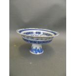 A Chinese blue and white porcelain stem bowl with frilled rim and painted floral decoration, 6½"
