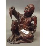 A Japanese carved hardwood figure of starving Buddha, mid C19th, 7" high (AF)