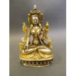 A Chinese metal figure of Buddha seated in meditation, 5½" high