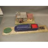A wooden model of a train and station, bears cast iron British Rail weight limit plaque, c1968,