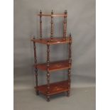 A Victorian four tier inlaid walnut whatnot on carved and turned supports, 27" x 11" x 53½"