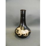 A Chinese Cizhou kiln bottle vase with incised twin kylin decoration, 11" high