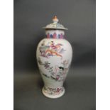 A Chinese famille rose porcelain jar and cover with enamel decoration of musicians entertaining