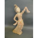 A Chinese Tang style painted terracotta and gilt figure of a dancing geisha, 18½" high