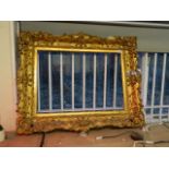 A C19th swept gilt frame, rebate 28½" x 20½" (AF losses)