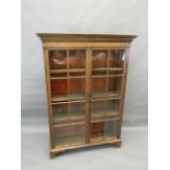 A Victorian mahogany bookcase with two glazed doors, raised on bracket supports, 42" x 12" x 60" (AF