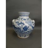 A Chinese Ming style blue and white porcelain bulbous vase with twin mask handles and painted carp