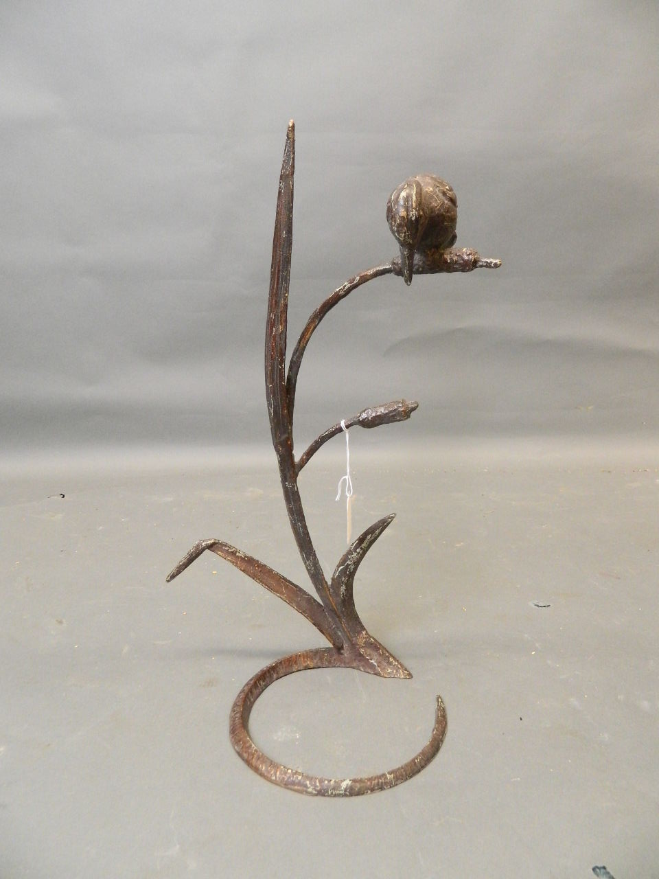 A bronzed mixed metal stand in the form of a kingfisher on a bulrush, 19" high