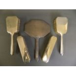 A lady's five piece Hallmarked silver vanity set, engraved monogram 'E', Birmingham 1936, mirror 11"