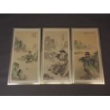 A set of three Chinese prints on silk, mountainous landscapes with pagodas, 27" x 13"