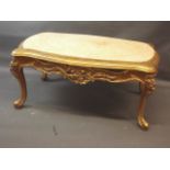 A giltwood occasional table with carved decoration and inset marble top, raised on cabriole