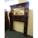 A large inlaid mahogany fire surround and overmantle with Art Nouveau open shelves and mirror,