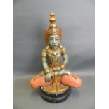 A carved and painted wood figure of a Hindu deity with a gilt crown, 24" high