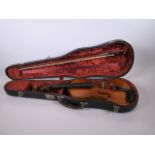 A violin, bow and case with a two piece back, stamped 502 to neck, bears label to interior, violin