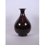 A Chinese flambé glazed pear shaped vase, seal mark to base, 11½" high