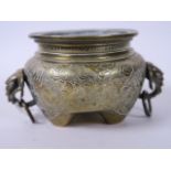 A Chinese bronze censer with elephant's head ring handles and engraved decoration, raised on three