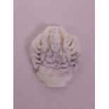 A Chinese white jade pendant with carved decoration of a goddess with many arms, 1½"