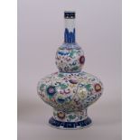 A Chinese polychrome double gourd porcelain vase with slender neck, enamel floral decoration and