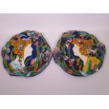 A pair of Majolica wall plaques in the Art Nouveau style decorated with flower girls, 12" diameter