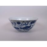 A Chinese blue and white porcelain bowl of lobed form, decorated with carp in a lotus pond, 8"