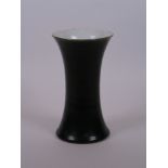 A Chinese black ground porcelain vase of waisted form, 7" high