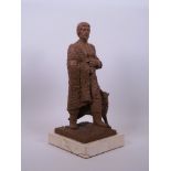 A terracotta maquette of a gentleman in furs with a wolf, signed 'M. Senserrich, 83', 13" high