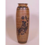 An Oriental stoneware hanging vase, with sgraffito style glaze, and dragon decoration, 15" high