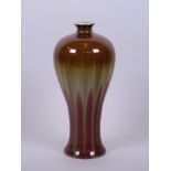 A Chinese pottery vase of waisted form with tri-colour glaze, 8" high