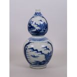 A Chinese blue and white double gourd porcelain vase with ribbed sides and decorative panels
