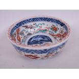 An Oriental Imari pattern porcelain bowl decorated with mythical beasts, 6" diameter