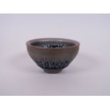 A Chinese Jian ware tea bowl with iridescent splash glaze decoration, 3½" diameter