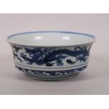 A Chinese Ming style blue and white porcelain steep sided bowl with dragon decoration, six character