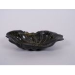 A Chinese carved horn trinket dish in the form of a lily pad, 5" x 2½"