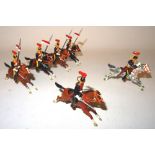 Britains four RARE 'plug shoulder' Lancers neatly repainted as 12th Lancers with officer and