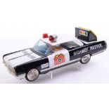 Ichiko (Japanese) Battery operated Buick Highway Patrol Car. Tinplate vehicle in black and white,