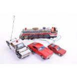 Four Japanese Battery Operated Tinplate Toys, Taiyo Camero, Nomura Police Car, Bandai Ford