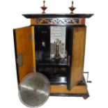 An upright coin-operated 9-inch Britannia disc musical box, Alexandra Deluxe Model, Ser. No. 5431,