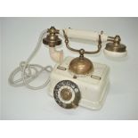 An early Danish ivory Bakelite and painted metal table telephone, Circa 1908, With Kjobenhavns