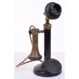 A good black and brass candlestick telephone, 1920s, with compact microphone, ebonite cap receiver