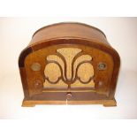 An Atwater Kent type 246 wireless receiver, Arched top, small window dial, wooden knobs.