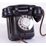 A Siemens black Bakelite wall telephone, 1930, with 200-series type bellbox, bar button and dial,