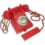 A rare type 312 red Bakelite telephone, Impressed mark 164-52, with the matching red Bakelite