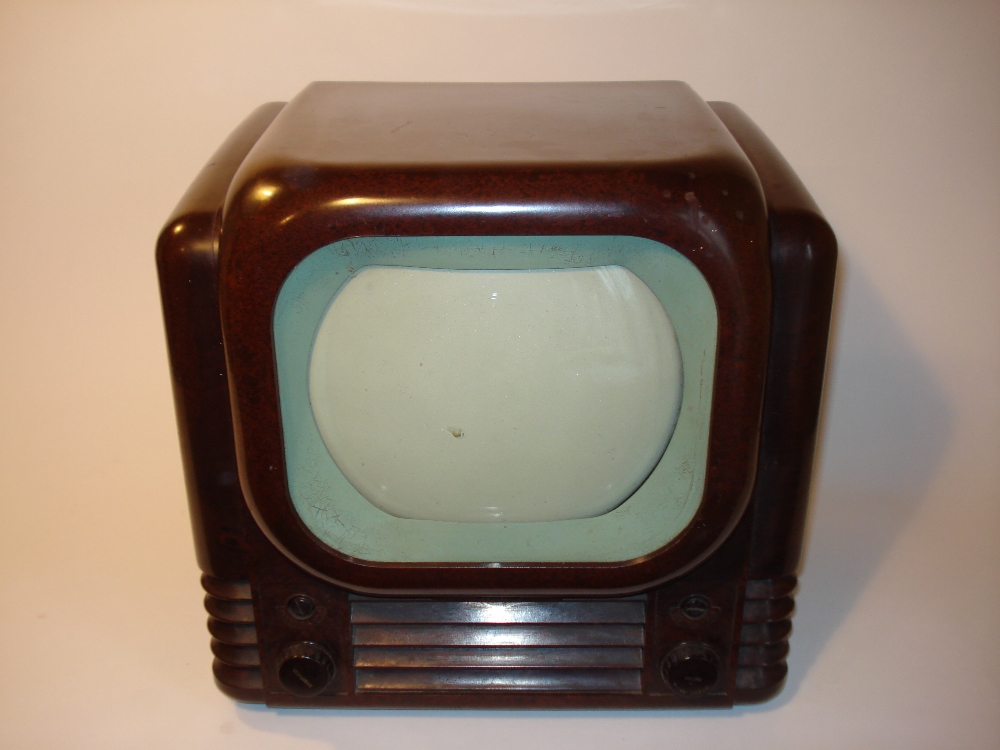 A Bush type 22 table television receiver,1950, 405-line, 8-inch screen, cream mask, in moulded brown